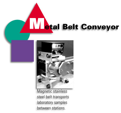Metal Belt Conveyor - Magnetic stainless steel belt transports laboratory samples between stations.